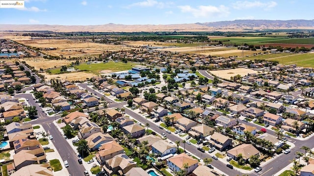 birds eye view of property featuring a mountain view