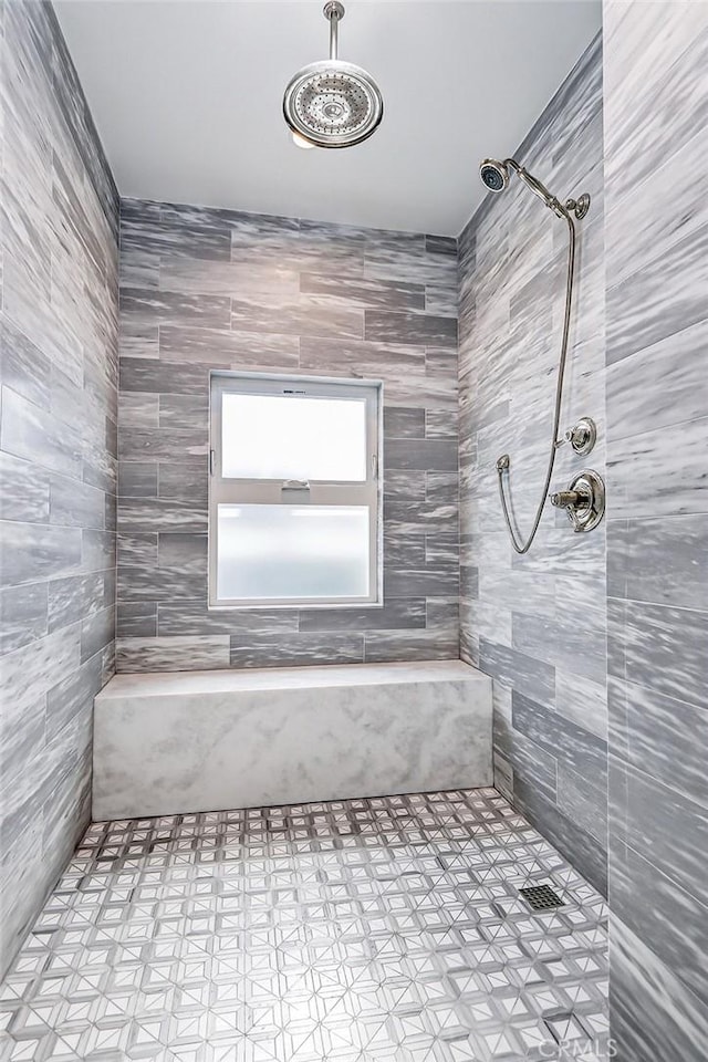 bathroom featuring tiled shower