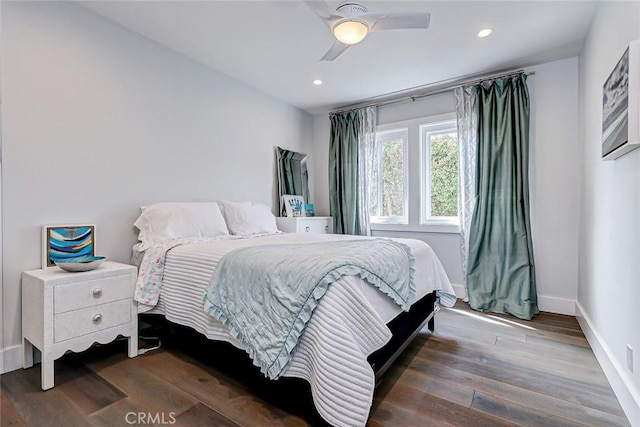 bedroom with dark wood-type flooring and ceiling fan