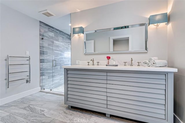 bathroom featuring walk in shower and vanity