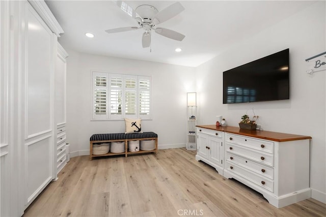 interior space with ceiling fan and light hardwood / wood-style floors