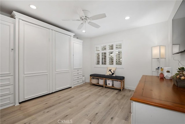 bedroom featuring light hardwood / wood-style floors and ceiling fan