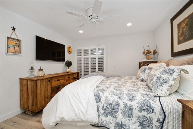 bedroom featuring ceiling fan and light hardwood / wood-style floors