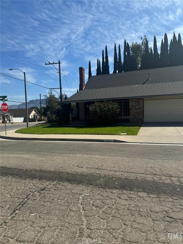 view of front of property with a garage and a front yard