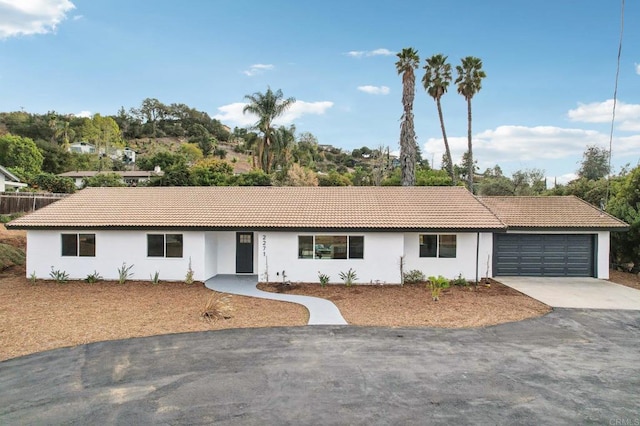 ranch-style home with a garage