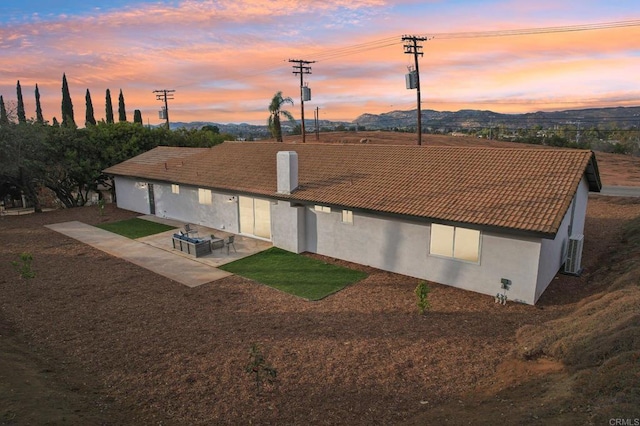 aerial view at dusk with a mountain view