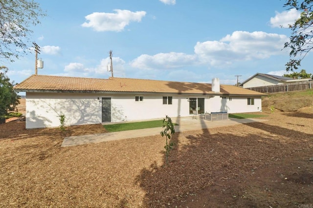 rear view of house featuring a patio area