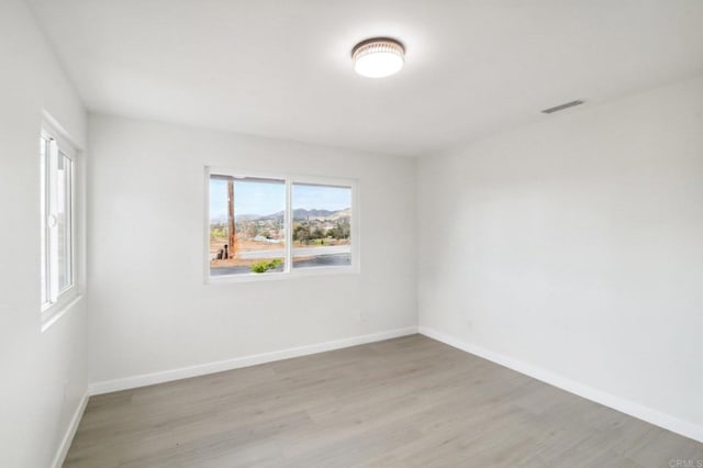 unfurnished room featuring light hardwood / wood-style flooring