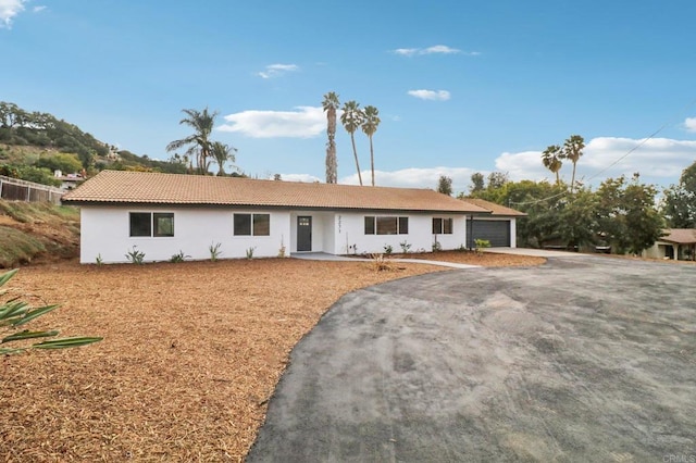 single story home featuring a garage