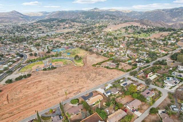 birds eye view of property featuring a mountain view