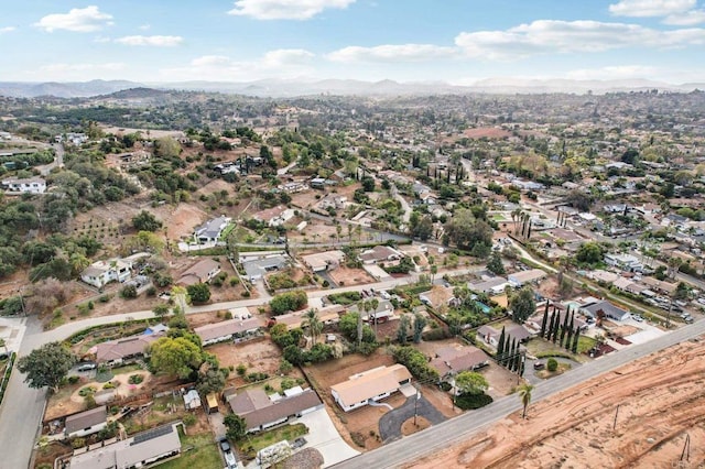 birds eye view of property featuring a mountain view