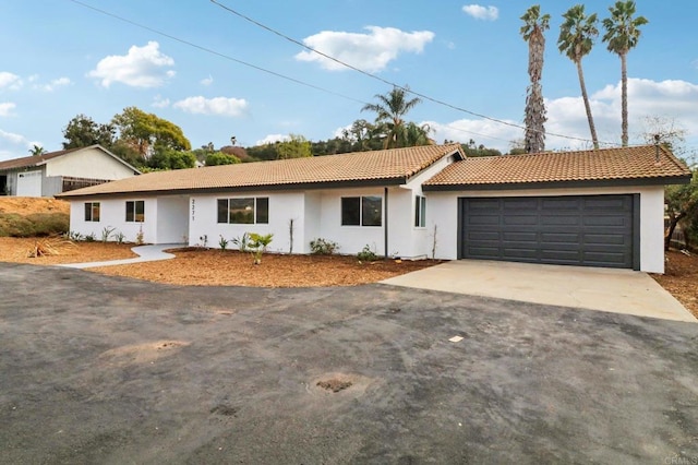 ranch-style home featuring a garage