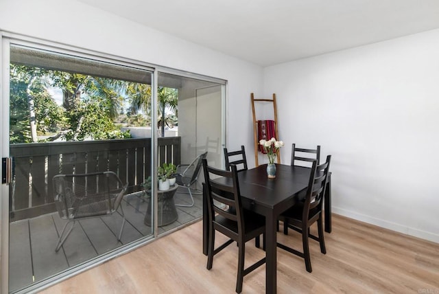 dining area with hardwood / wood-style flooring