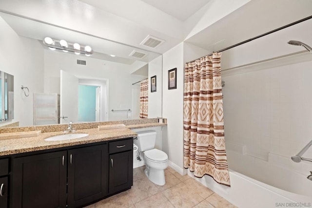 full bathroom with tile patterned flooring, vanity, shower / tub combo, and toilet