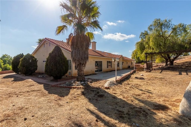 view of home's exterior with a patio