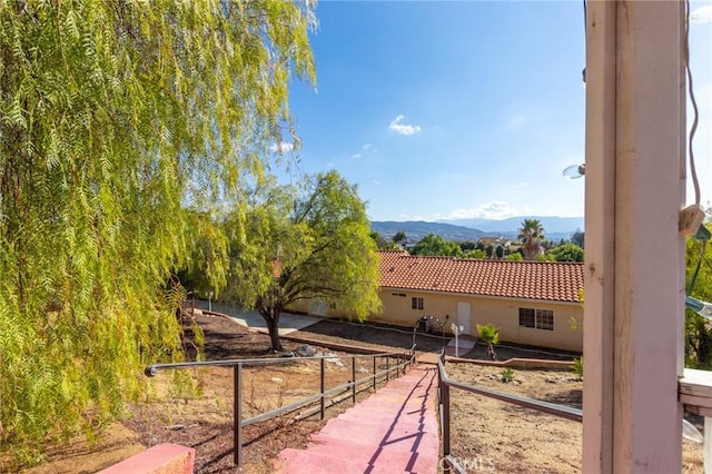 view of side of property with a mountain view