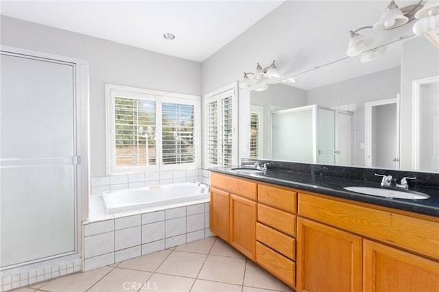 bathroom with vanity, shower with separate bathtub, and tile patterned flooring