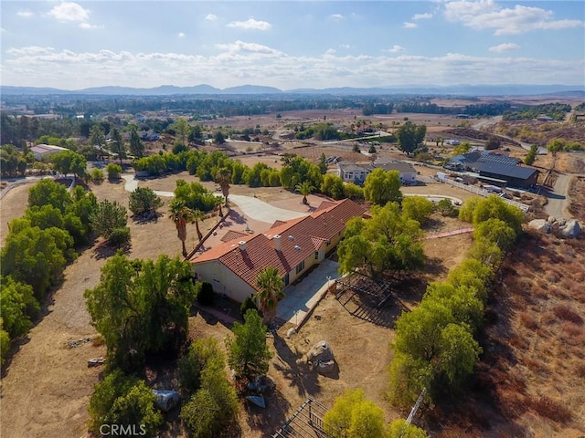 birds eye view of property featuring a mountain view