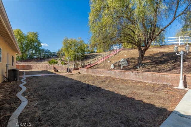 view of yard featuring central AC