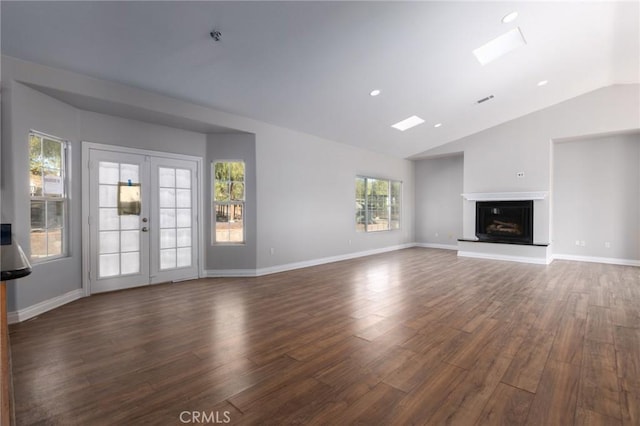 unfurnished living room featuring french doors, lofted ceiling, and dark hardwood / wood-style flooring