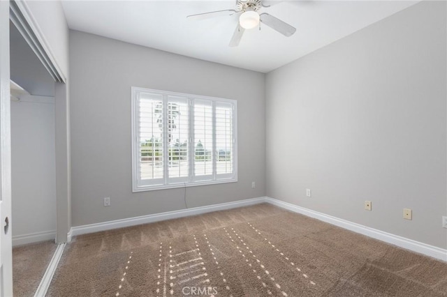 unfurnished bedroom featuring a closet, ceiling fan, and carpet flooring