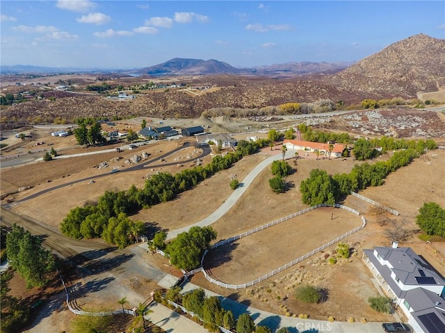 birds eye view of property with a mountain view