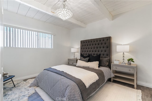 bedroom with beamed ceiling, wooden ceiling, hardwood / wood-style flooring, and a notable chandelier