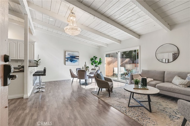 living room with wood ceiling, wood-type flooring, and vaulted ceiling with beams