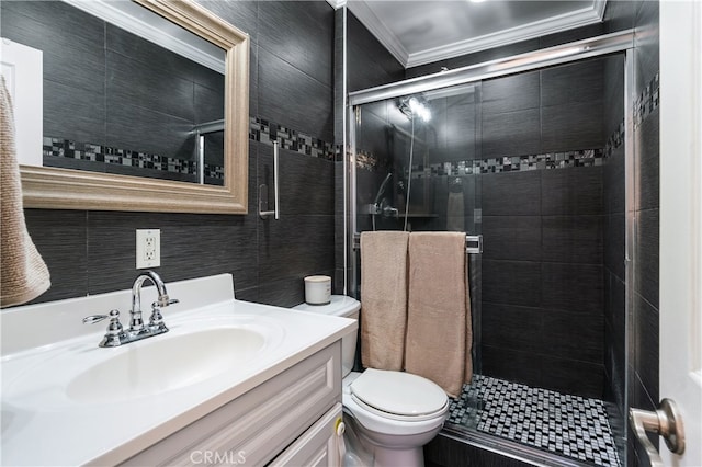 bathroom with vanity, ornamental molding, an enclosed shower, and toilet