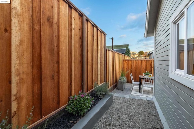 view of property exterior with a patio area