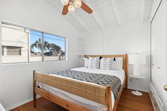 bedroom featuring dark hardwood / wood-style flooring, vaulted ceiling with beams, wooden ceiling, and ceiling fan