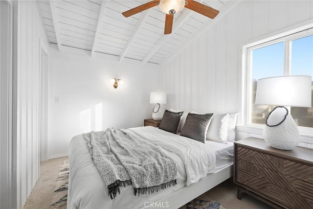 bedroom featuring vaulted ceiling with beams, wood ceiling, ceiling fan, and carpet