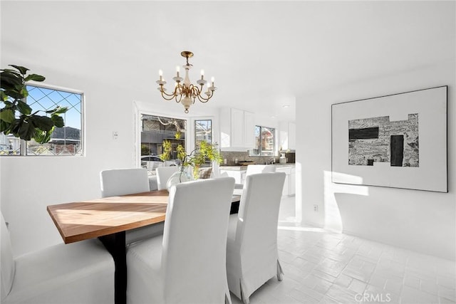 dining room with a notable chandelier