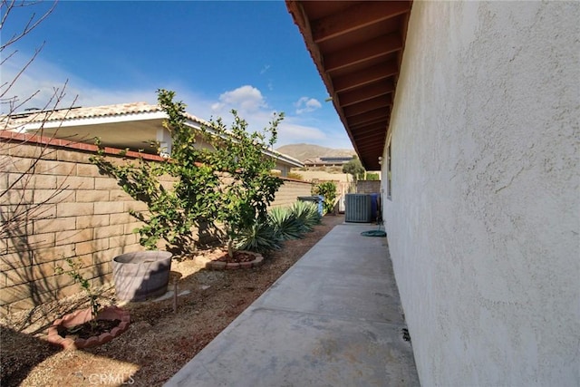 view of side of home with cooling unit