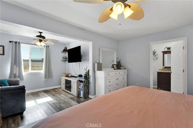 bedroom with wood-type flooring and ceiling fan