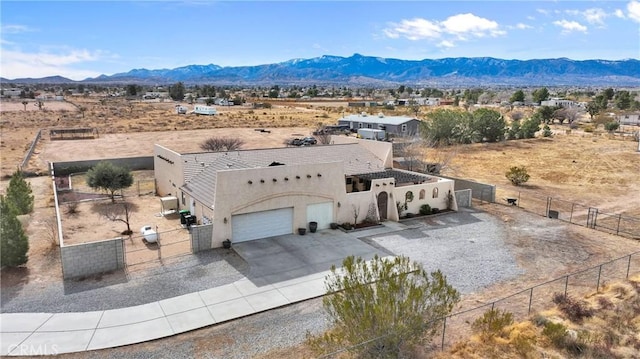 birds eye view of property with a mountain view