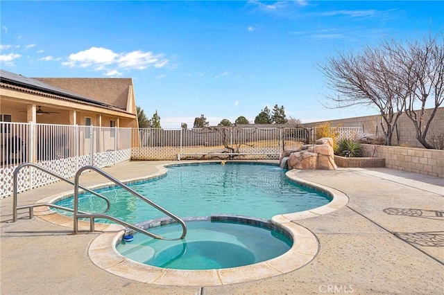 view of pool with an in ground hot tub and a patio area