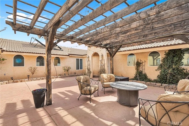 view of patio with an outdoor fire pit and a pergola