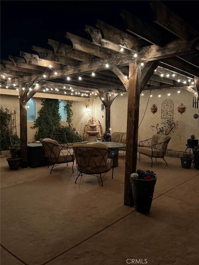 patio at night with a pergola