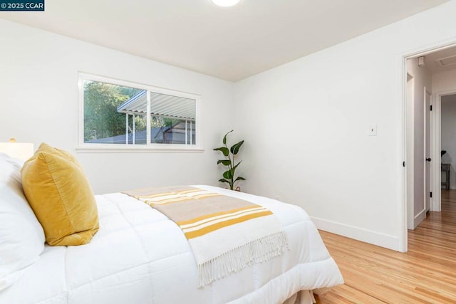 bedroom featuring wood-type flooring