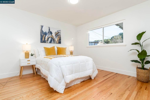 bedroom with light hardwood / wood-style flooring