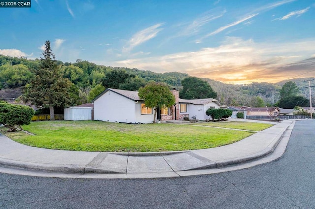 view of front of property with a lawn