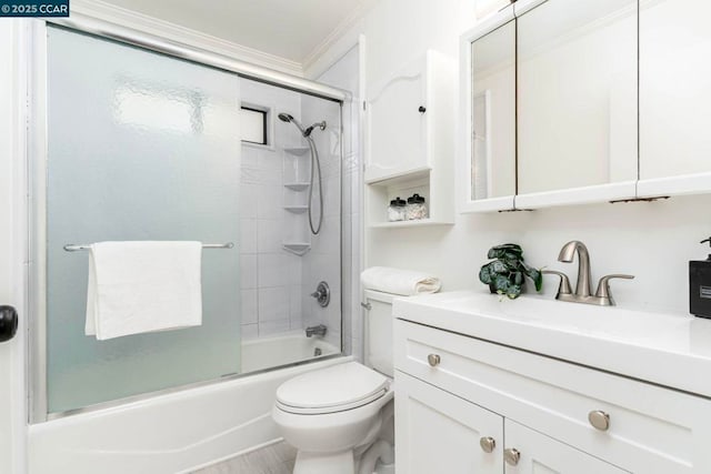 full bathroom featuring toilet, vanity, shower / bath combination with glass door, and crown molding