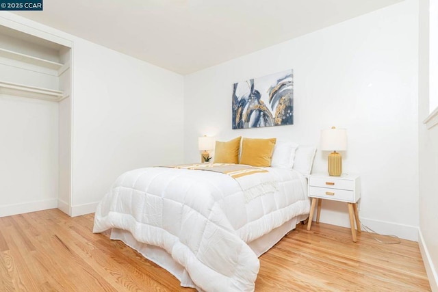 bedroom with wood-type flooring