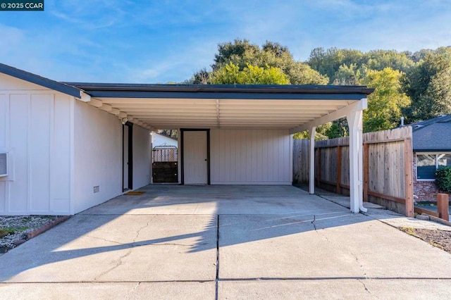 view of vehicle parking with a carport