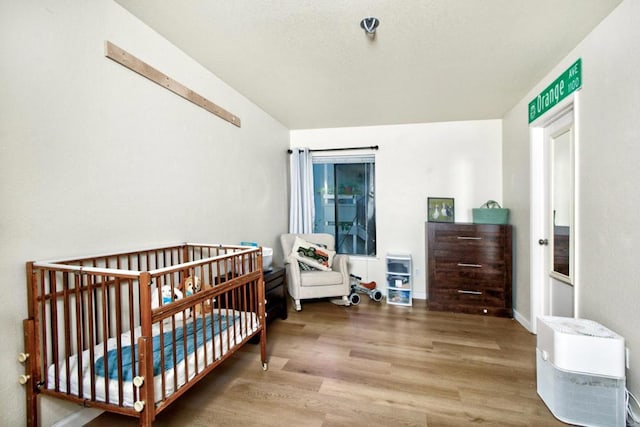 bedroom featuring hardwood / wood-style floors