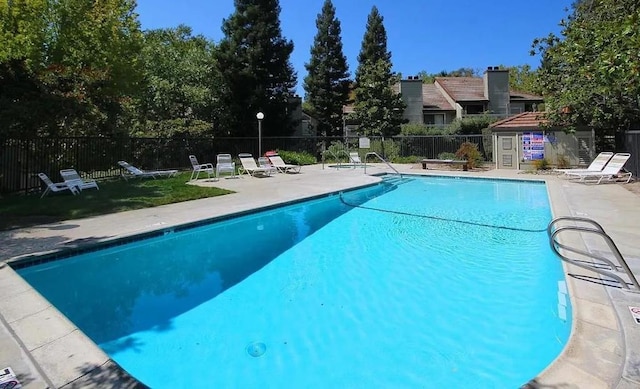 view of swimming pool featuring a patio area