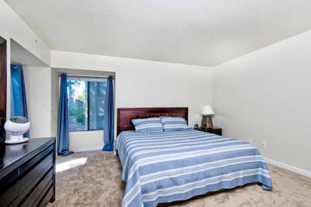 bedroom with light colored carpet