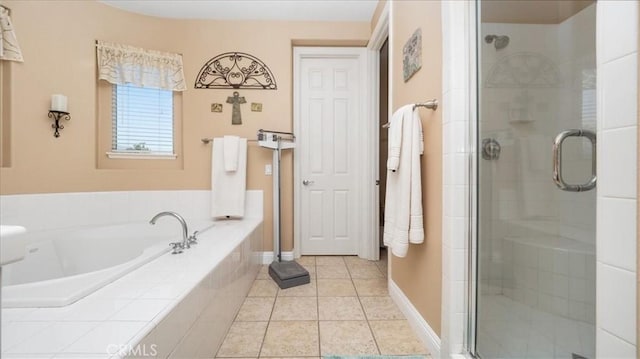 bathroom with tile patterned flooring and independent shower and bath