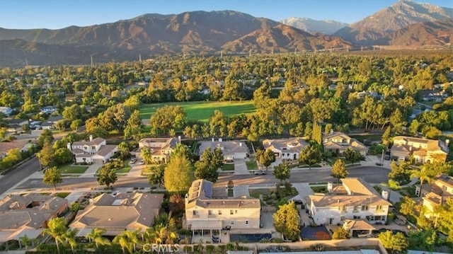 birds eye view of property with a mountain view